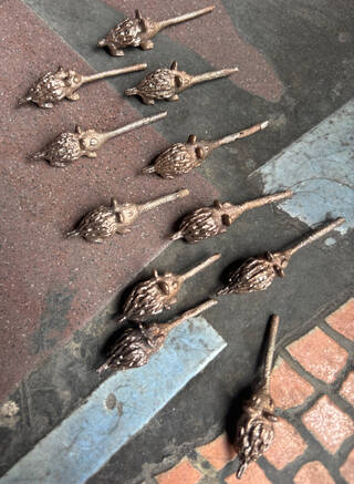 small brown bronze creatures with long 'noses'