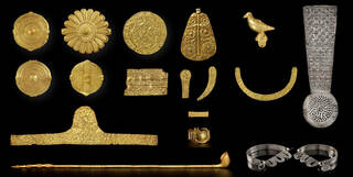 Gold and silver objects on a black background