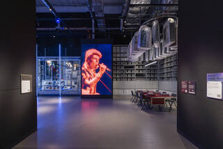 A room with a large screen