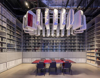 Table with hanging costumes above 