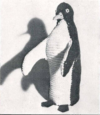 Photograph of a penguin knitted toy