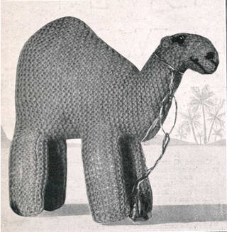 Photograph of a camel knitted toy