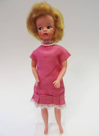 Sindy doll in pink dress and pearls