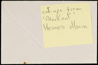 post-it note on the back of an envelope with handwriting