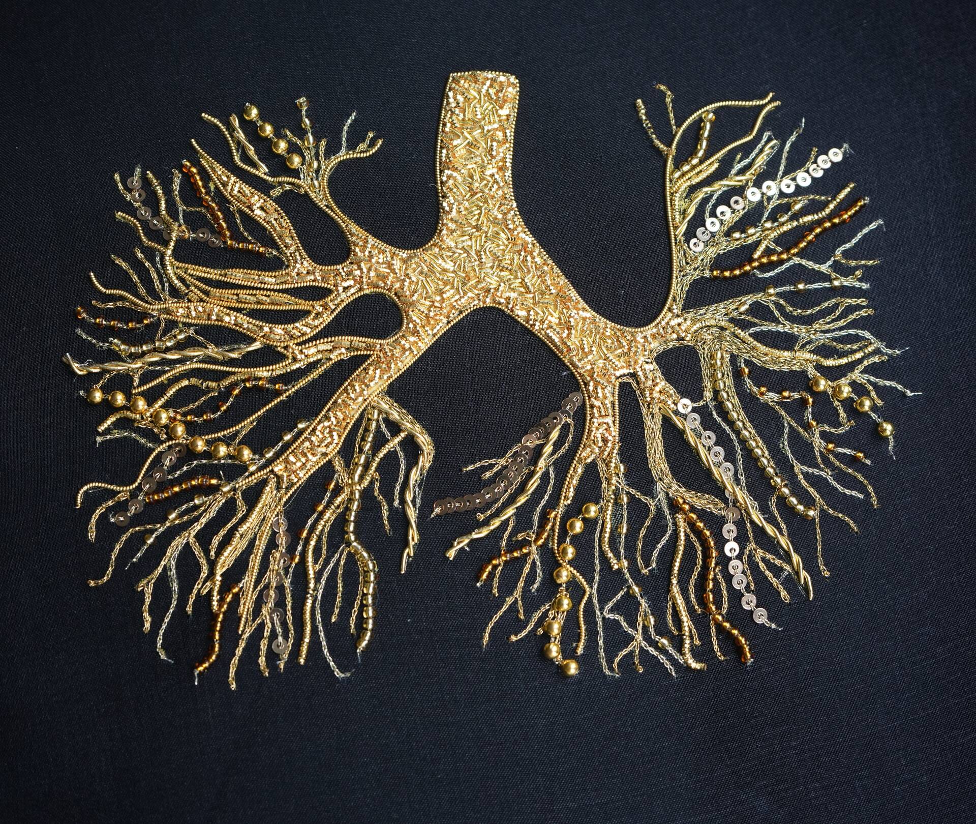 Catalogue cover showing a model in a long formal dress in a floral print with text VOGUE PATTERNS, volume 1 and pattern number V2155