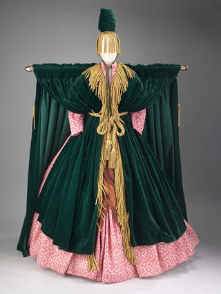 Green and pink fringed costume with wide shoulders