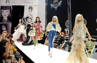Barbie dolls on a 'catwalk'