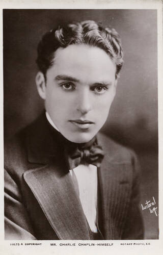 black and white portrait photograph of a young Charlie Chaplin